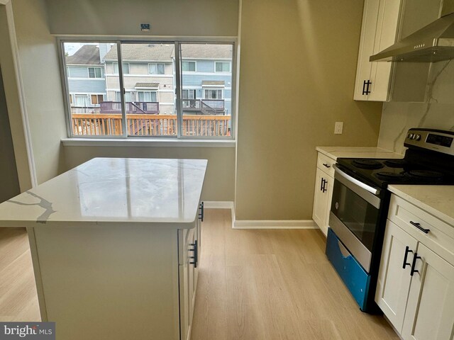 3627 Longridge Ct, Abingdon, MD 21009 - kitchen featuring electric stove, wall chimney exhaust hood, light wood-style floors, baseboards, and light stone counters