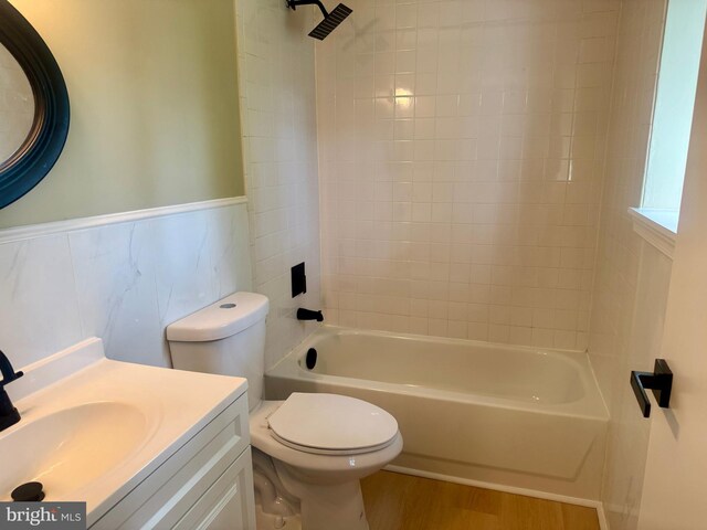 3627 Longridge Ct, Abingdon, MD 21009 - full bathroom with toilet, vanity, wood finished floors, tub / shower combination, and a wainscoted wall