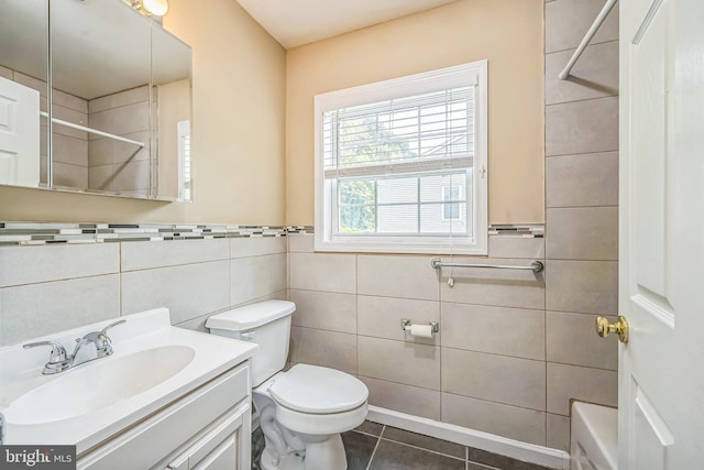 216 Parker Ave, Philadelphia, PA 19128 - full bathroom featuring tile walls, tile patterned floors, vanity, and toilet