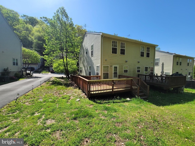 216 Parker Ave, Philadelphia, PA 19128 - back of house with a deck and a yard