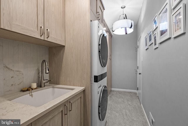 33 Jonquil Dr, Newtown, PA 18940 - washroom with stacked washing machine and dryer, cabinet space, and baseboards