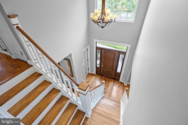 33 Jonquil Dr, Newtown, PA 18940 - entryway featuring a towering ceiling, hardwood / wood-style floors, a chandelier, and plenty of natural light