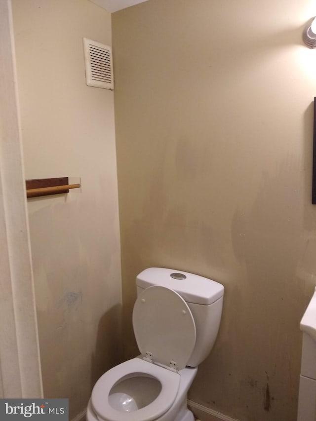 9438 Waterford Dr, Manassas, VA 20110 - bathroom featuring toilet, vanity, and baseboards