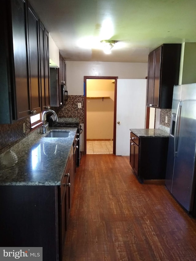 9438 Waterford Dr, Manassas, VA 20110 - kitchen with stainless steel fridge, backsplash, wood finished floors, and a sink