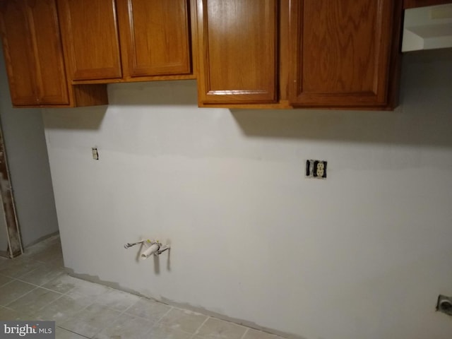 9438 Waterford Dr, Manassas, VA 20110 - laundry area with light tile patterned floors