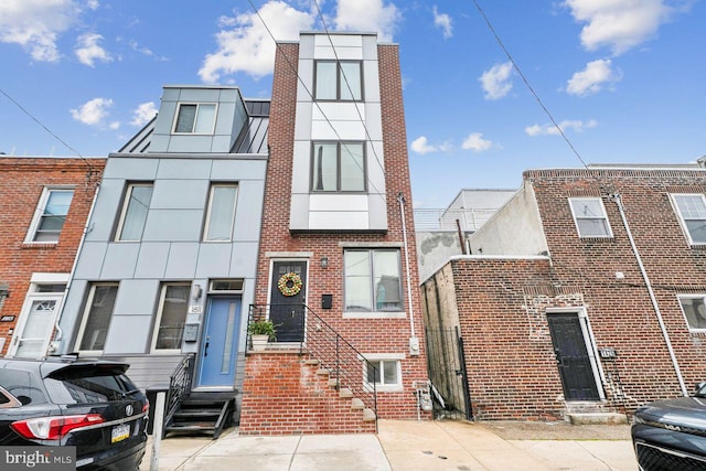 1809 Wilder St, Philadelphia, PA 19146 - townhome / multi-family property featuring entry steps, brick siding, and stucco siding