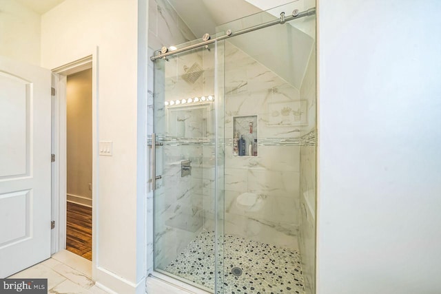 1809 Wilder St, Philadelphia, PA 19146 - bathroom featuring a marble finish shower, marble finish flooring, and baseboards