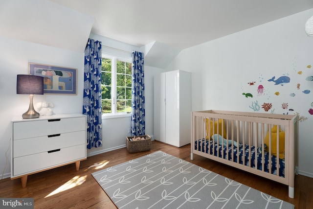 9 Laurel Wood, Lawrenceville, NJ 08648 - bedroom featuring wood finished floors, a nursery area, and baseboards