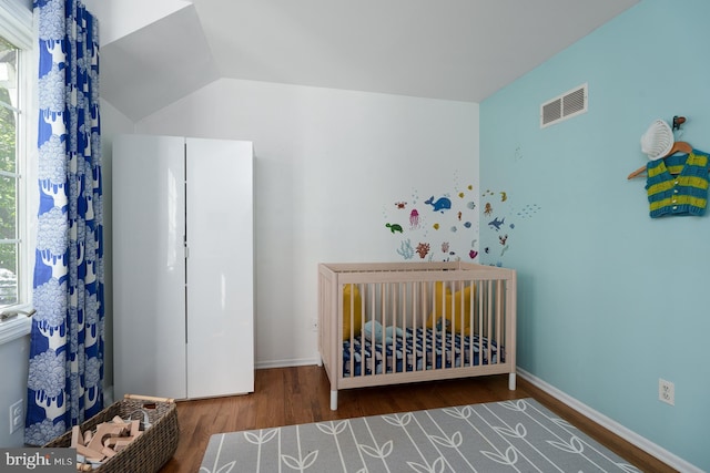 9 Laurel Wood, Lawrenceville, NJ 08648 - bedroom with wood finished floors, a nursery area, and baseboards