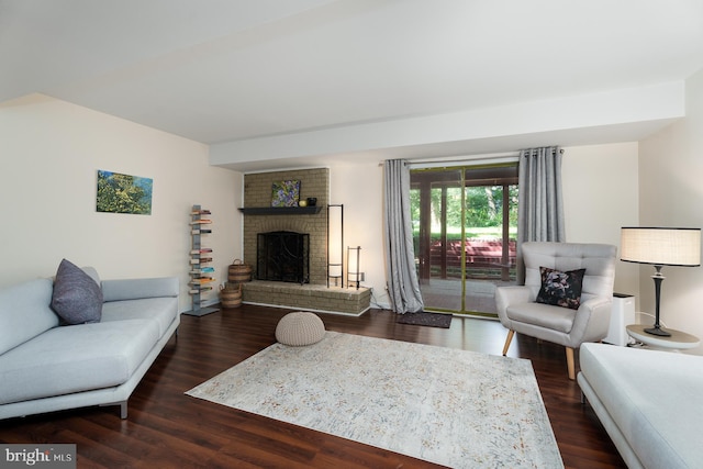 9 Laurel Wood, Lawrenceville, NJ 08648 - living area featuring a brick fireplace and wood finished floors