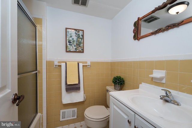 9 Laurel Wood, Lawrenceville, NJ 08648 - bathroom featuring tile walls, toilet, vanity, a wainscoted wall, and enclosed tub / shower combo