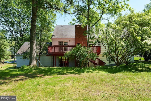 9 Laurel Wood, Lawrenceville, NJ 08648 - rear view of property with a deck, a lawn, stairway, and roof with shingles