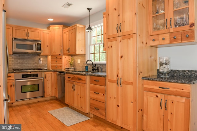 457 Langley Rd, Pittsgrove, NJ 08318 - kitchen featuring stainless steel appliances, a sink, light brown cabinetry, tasteful backsplash, and light wood finished floors