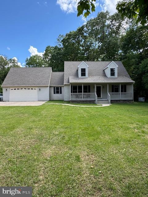 457 Langley Rd, Pittsgrove, NJ 08318 - cape cod home with covered porch, a front yard, an attached garage, driveway, and a shingled roof