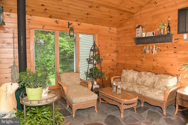 457 Langley Rd, Pittsgrove, NJ 08318 - living room featuring lofted ceiling, wood walls, stone finish flooring, a wood stove, and wooden ceiling