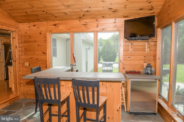 457 Langley Rd, Pittsgrove, NJ 08318 - kitchen featuring vaulted ceiling, stainless steel fridge, stainless steel built in fridge, wood walls, and wooden ceiling