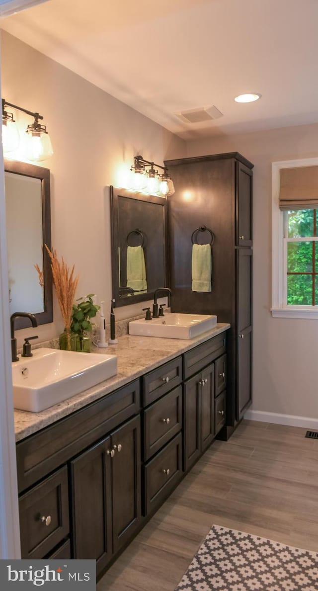 457 Langley Rd, Pittsgrove, NJ 08318 - full bath with double vanity, wood finished floors, baseboards, and recessed lighting