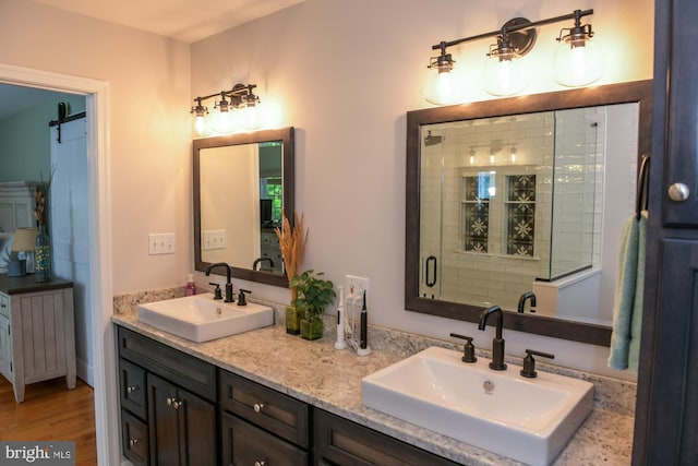 457 Langley Rd, Pittsgrove, NJ 08318 - full bathroom featuring double vanity, wood finished floors, and a shower stall