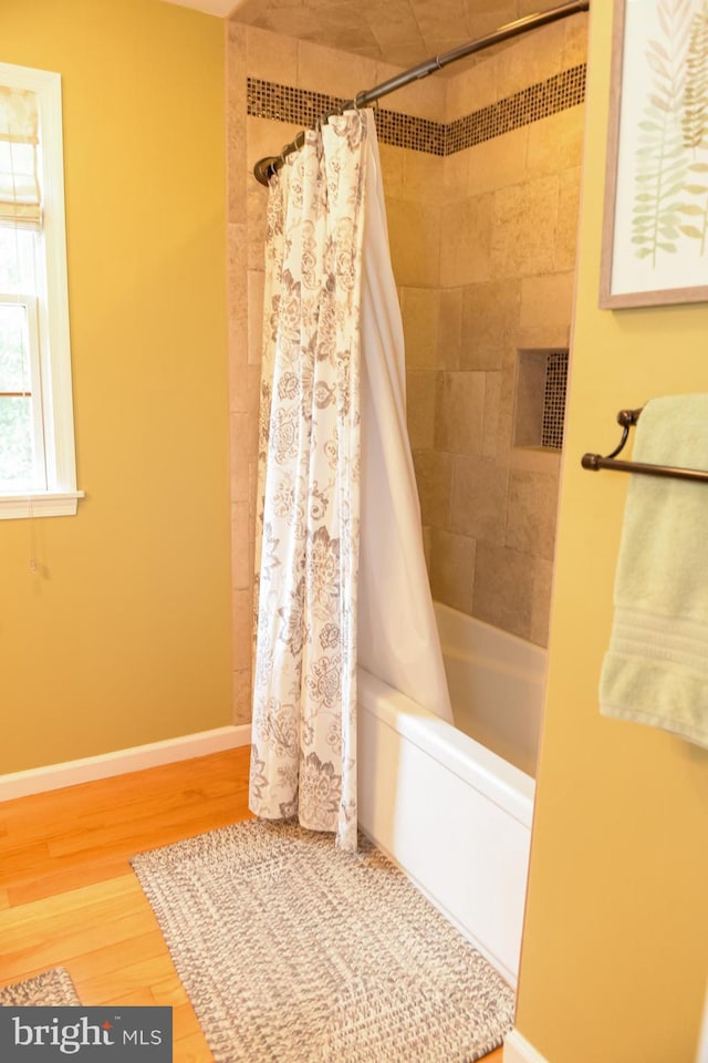 457 Langley Rd, Pittsgrove, NJ 08318 - bathroom with wood finished floors, shower / bath combination with curtain, and baseboards