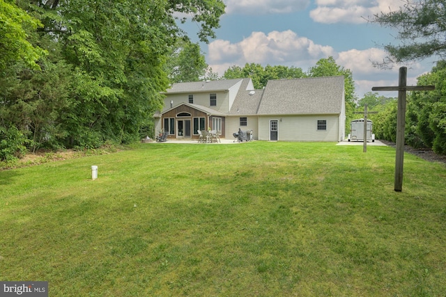457 Langley Rd, Pittsgrove, NJ 08318 - back of property with a patio area and a lawn