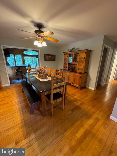 457 Langley Rd, Pittsgrove, NJ 08318 - dining room with a ceiling fan, baseboards, and light wood finished floors