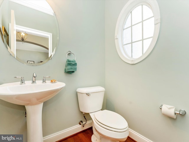 2507 Island Grove Blvd, Frederick, MD 21701 - half bathroom featuring baseboards, toilet, and wood finished floors