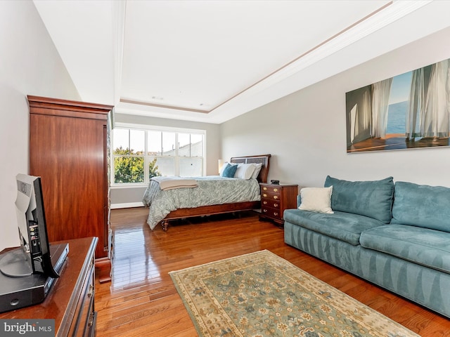 2507 Island Grove Blvd, Frederick, MD 21701 - bedroom featuring wood finished floors, a raised ceiling, and baseboards