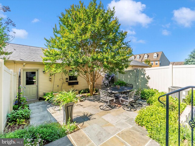 2507 Island Grove Blvd, Frederick, MD 21701 - fenced backyard with a patio and outdoor dining area