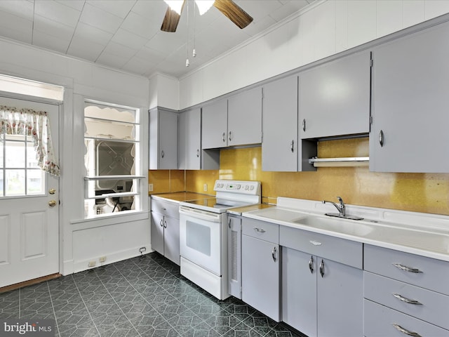138 W Main St, Schuylkill Haven, PA 17972 - kitchen featuring white electric stove, gray cabinets, a sink, ceiling fan, and dark flooring