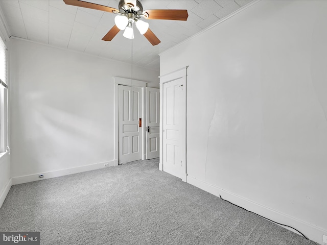 138 W Main St, Schuylkill Haven, PA 17972 - unfurnished bedroom with carpet floors, baseboards, crown molding, and ceiling fan