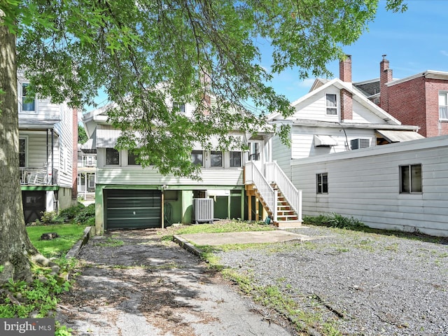 138 W Main St, Schuylkill Haven, PA 17972 - view of front of property with central AC, a chimney, and a garage