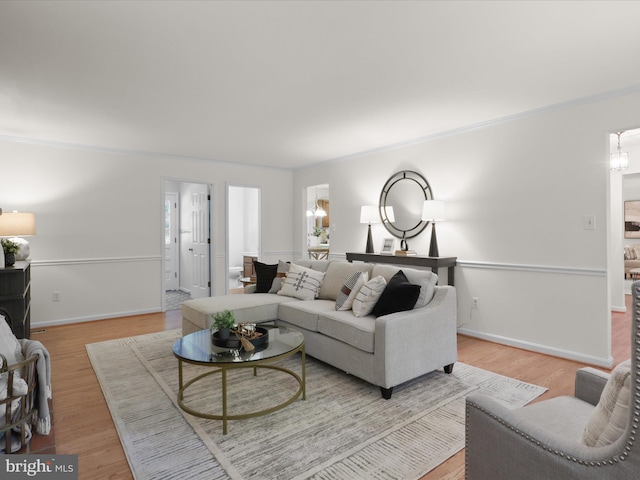 7449 Maple Branch Rd, Clifton, VA 20124 - living room featuring wood finished floors, baseboards, and crown molding