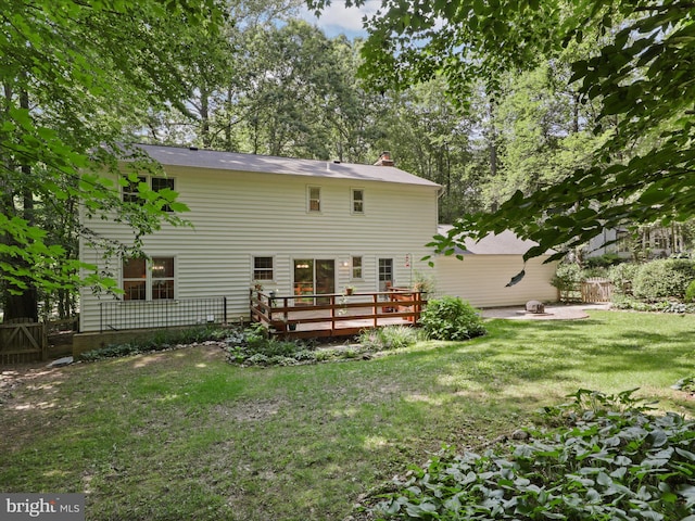 7449 Maple Branch Rd, Clifton, VA 20124 - back of house featuring a wooden deck, a fire pit, and a chimney