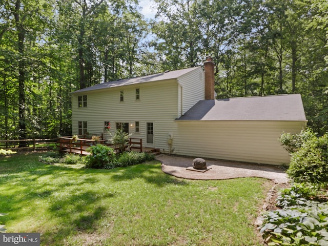 7449 Maple Branch Rd, Clifton, VA 20124 - rear view of property with a deck, a fire pit, and a chimney