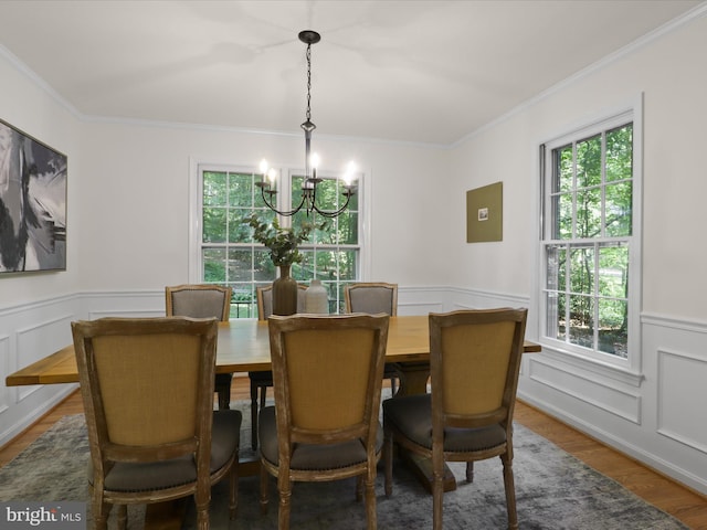 7449 Maple Branch Rd, Clifton, VA 20124 - dining space featuring a chandelier, ornamental molding, a wainscoted wall, wood finished floors, and a decorative wall