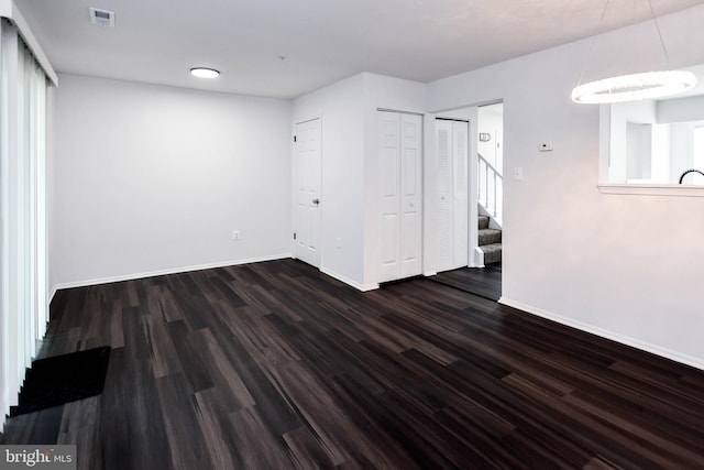 5936 S Hil Mar Cir, District Heights, MD 20747 - spare room with stairway, baseboards, and wood finished floors