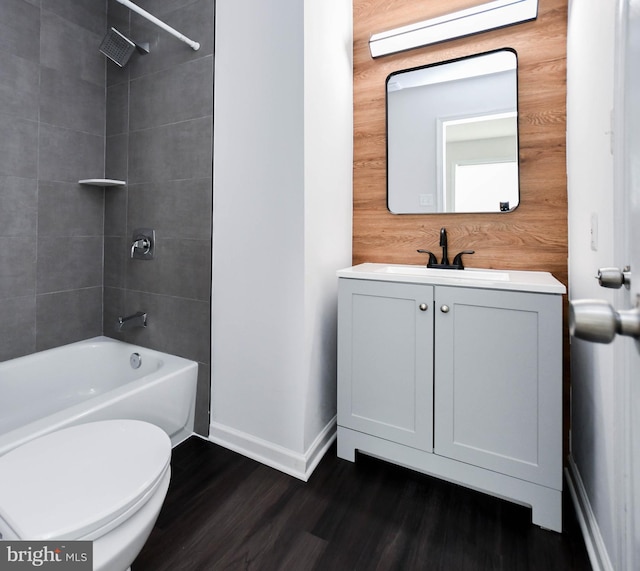 5936 S Hil Mar Cir, District Heights, MD 20747 - full bathroom with baseboards, shower / washtub combination, vanity, toilet, and wood finished floors