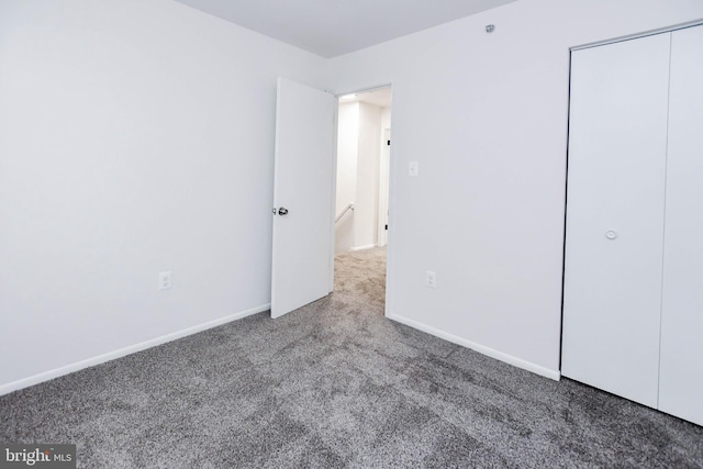5936 S Hil Mar Cir, District Heights, MD 20747 - unfurnished bedroom with carpet, baseboards, and a closet