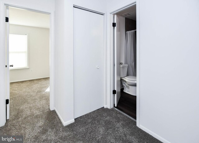 5936 S Hil Mar Cir, District Heights, MD 20747 - hall featuring dark colored carpet and baseboards