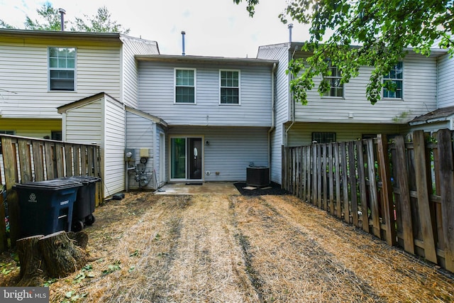5936 S Hil Mar Cir, District Heights, MD 20747 - rear view of house with central AC and a fenced backyard