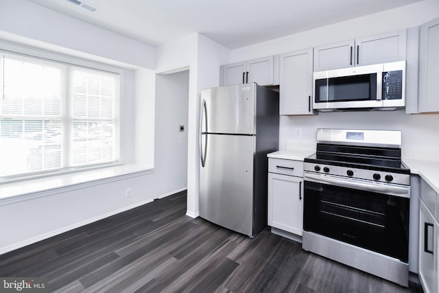 5936 S Hil Mar Cir, District Heights, MD 20747 - kitchen featuring appliances with stainless steel finishes, dark wood-style floors, light countertops, baseboards, and gray cabinets