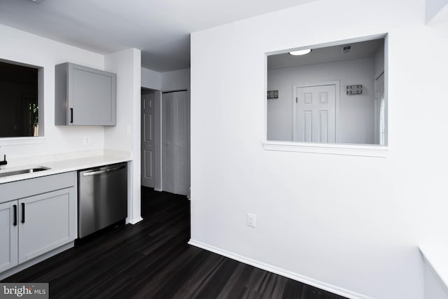 5936 S Hil Mar Cir, District Heights, MD 20747 - kitchen featuring dishwasher, a sink, gray cabinetry, dark wood-style flooring, and light countertops