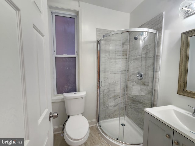2218 Ruskin Ave, Baltimore, MD 21217 - bathroom with toilet, a stall shower, vanity, and baseboards