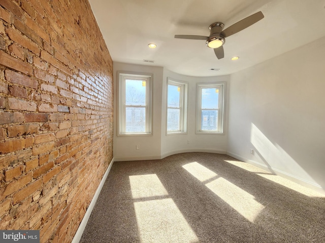 2218 Ruskin Ave, Baltimore, MD 21217 - carpeted empty room featuring baseboards, a ceiling fan, brick wall, and recessed lighting