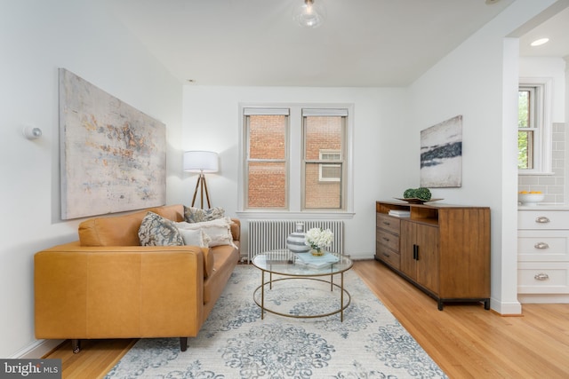 3709 Jocelyn St NW, Washington, DC 20015 - living area featuring radiator, light wood finished floors, and baseboards