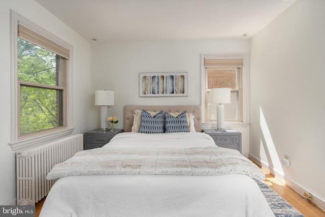 3709 Jocelyn St NW, Washington, DC 20015 - bedroom featuring radiator heating unit, wood finished floors, and baseboards