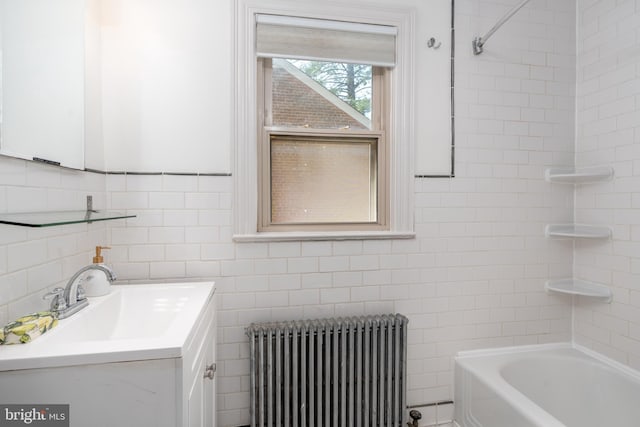 3709 Jocelyn St NW, Washington, DC 20015 - bathroom featuring radiator heating unit, tile walls, vanity, and tub / shower combination