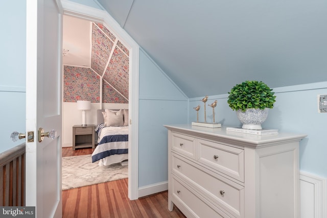 3709 Jocelyn St NW, Washington, DC 20015 - bedroom featuring vaulted ceiling, light wood finished floors, and wainscoting