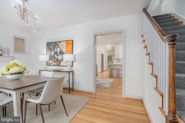 3709 Jocelyn St NW, Washington, DC 20015 - dining space featuring stairs, light wood finished floors, and baseboards