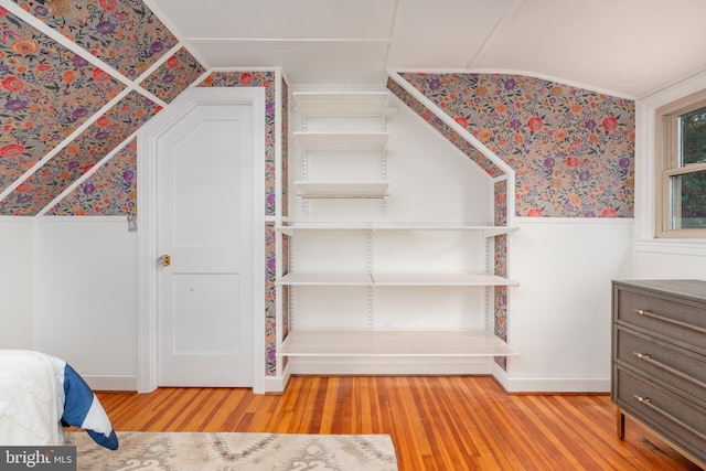 3709 Jocelyn St NW, Washington, DC 20015 - unfurnished bedroom featuring wainscoting, wallpapered walls, and wood finished floors